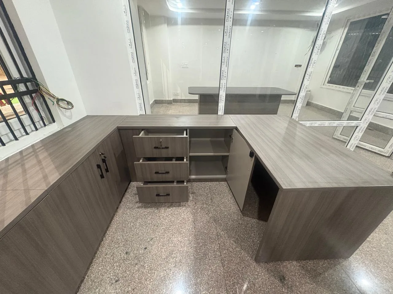 Custom office desk and drawer storage viewed from above