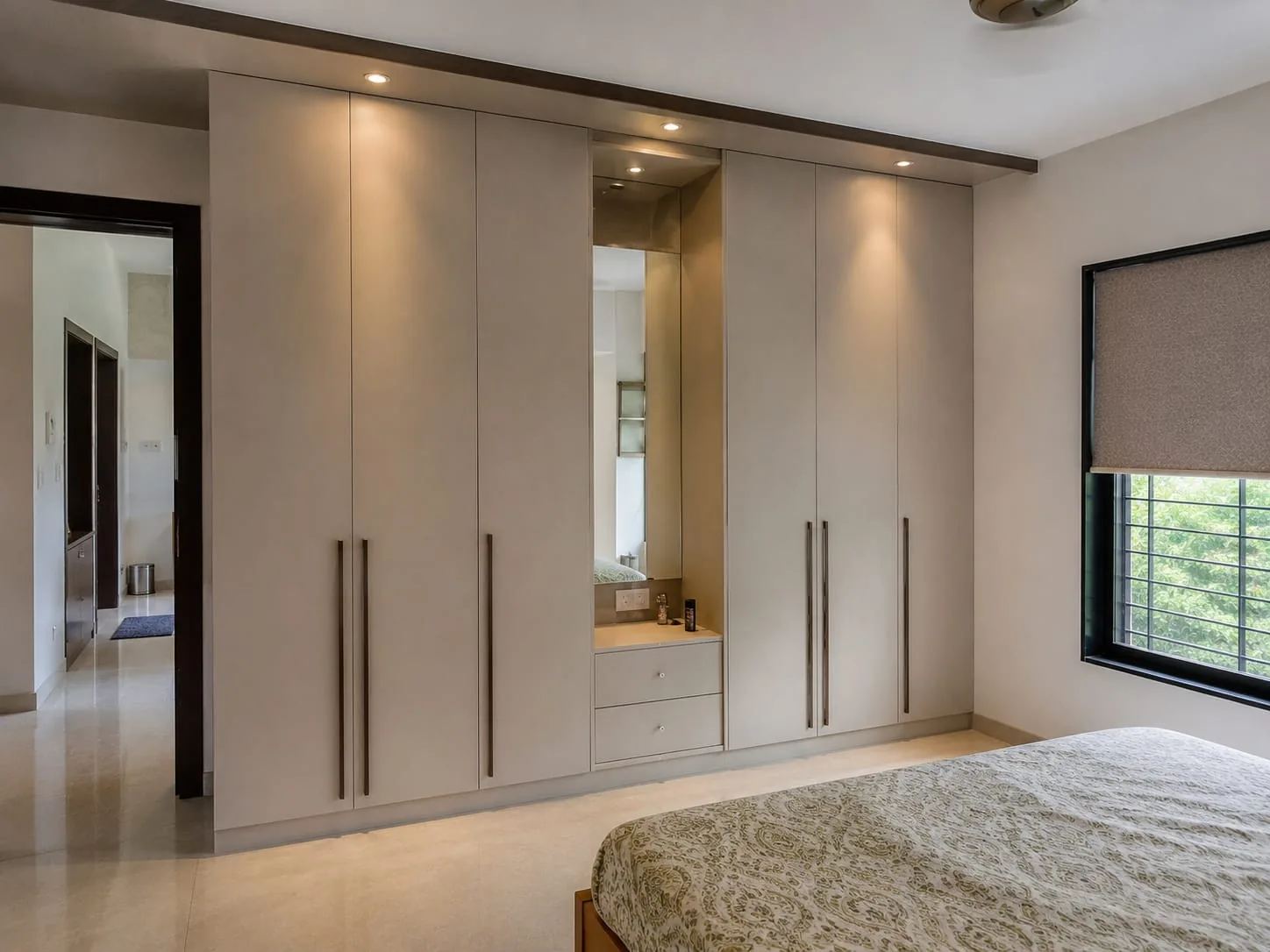 Completed ivory wardrobe with integrated dressing mirror